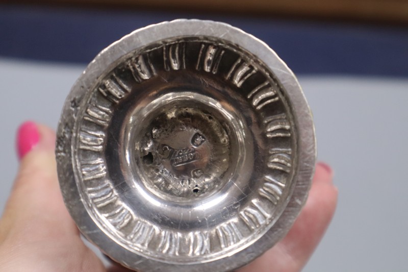 An early George III silver cream jug, London, 1764, with later embossed decoration, 12cm, 4 oz.